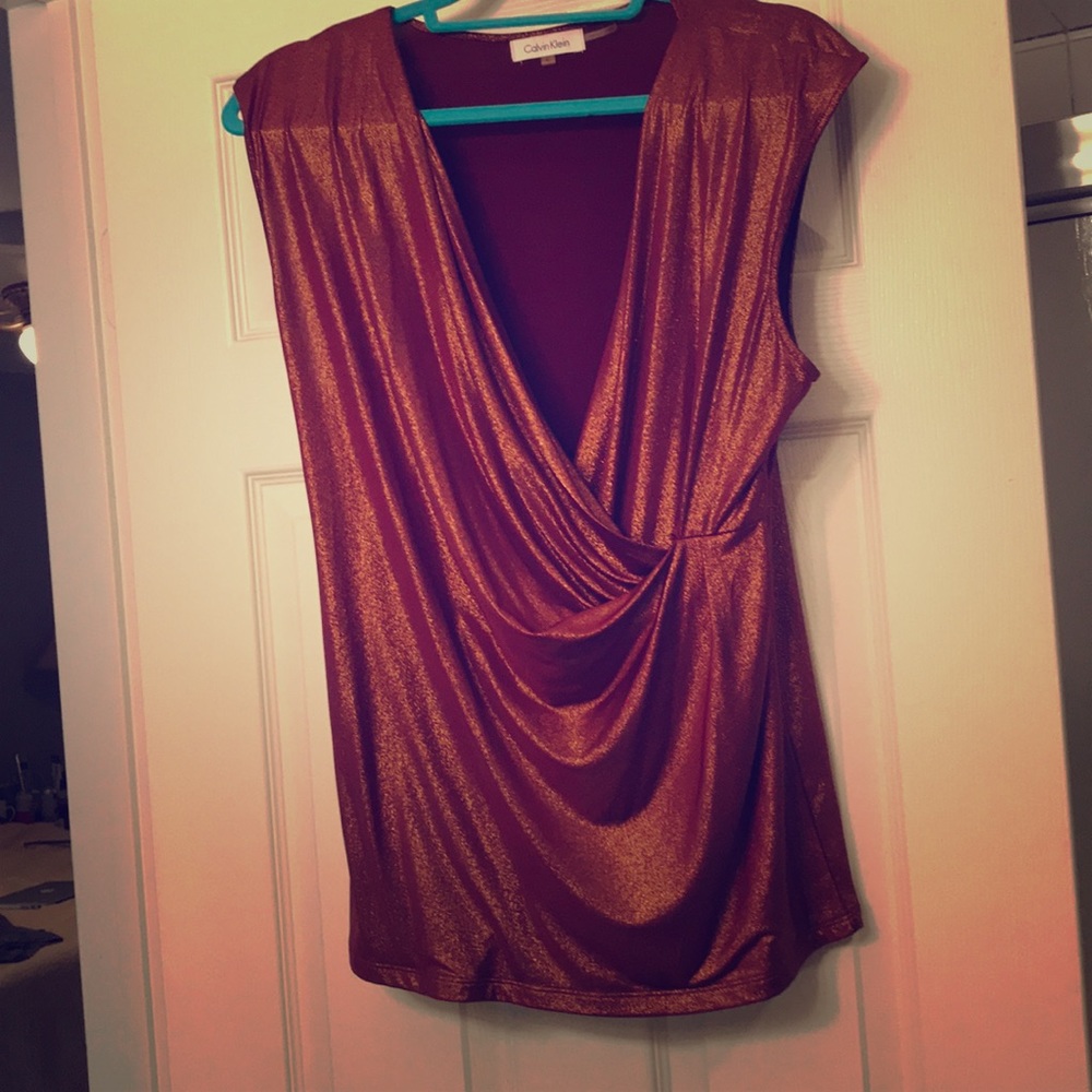 Shimmery dressy orange gold top. Worn once.